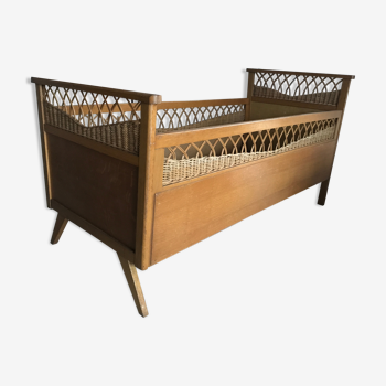 Rattan baby bed and vintage wood