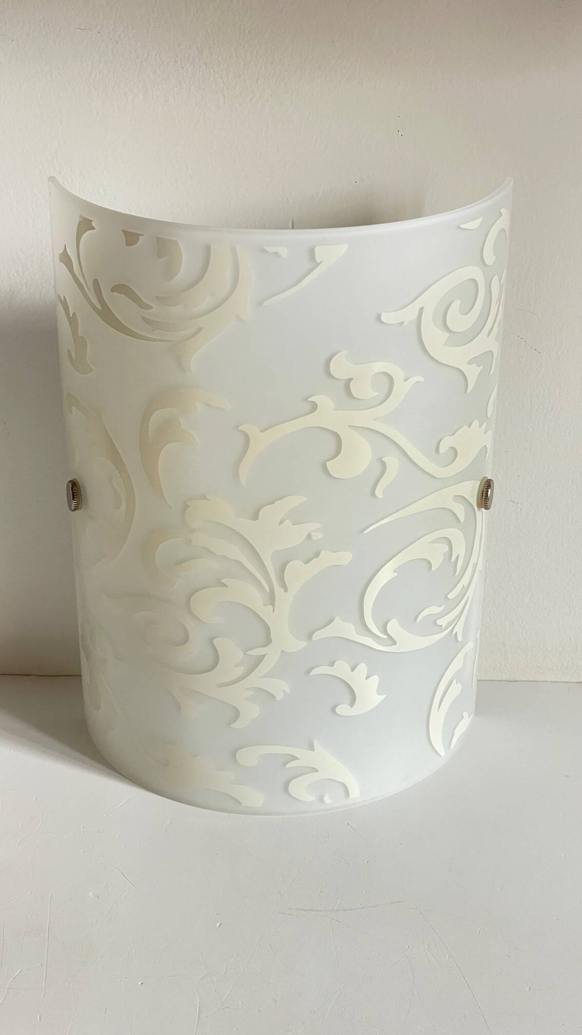 Polished and screen-printed glass sconce by eglo