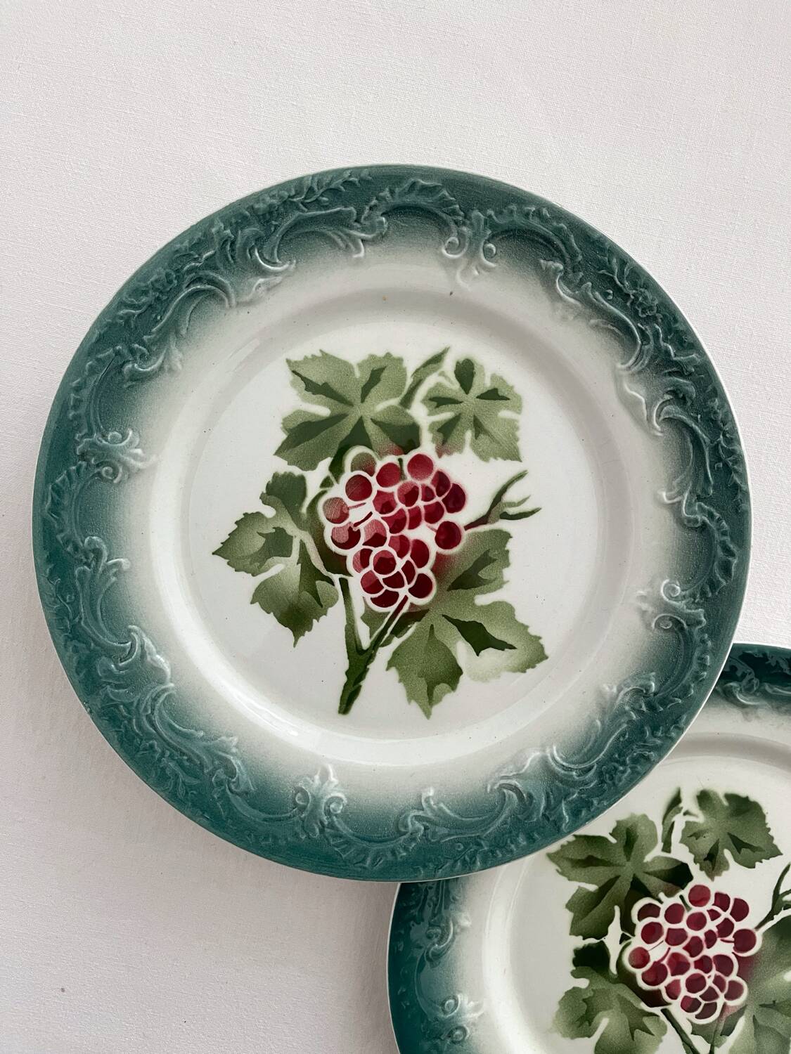 2 antique Pexonne earthenware dessert plates with grapes