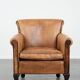 Vintage sheepskin armchair with a beautiful light colour and elegant legs