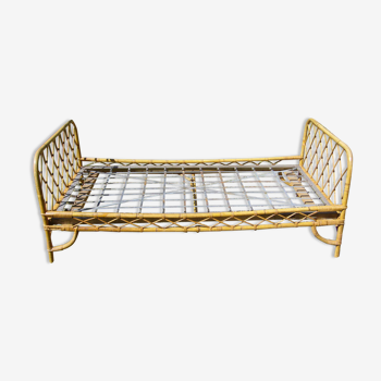 Vintage rattan bed and its box spring