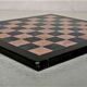 Small chessboard in coral marble and black marble - Italy - Second half of the twentieth century