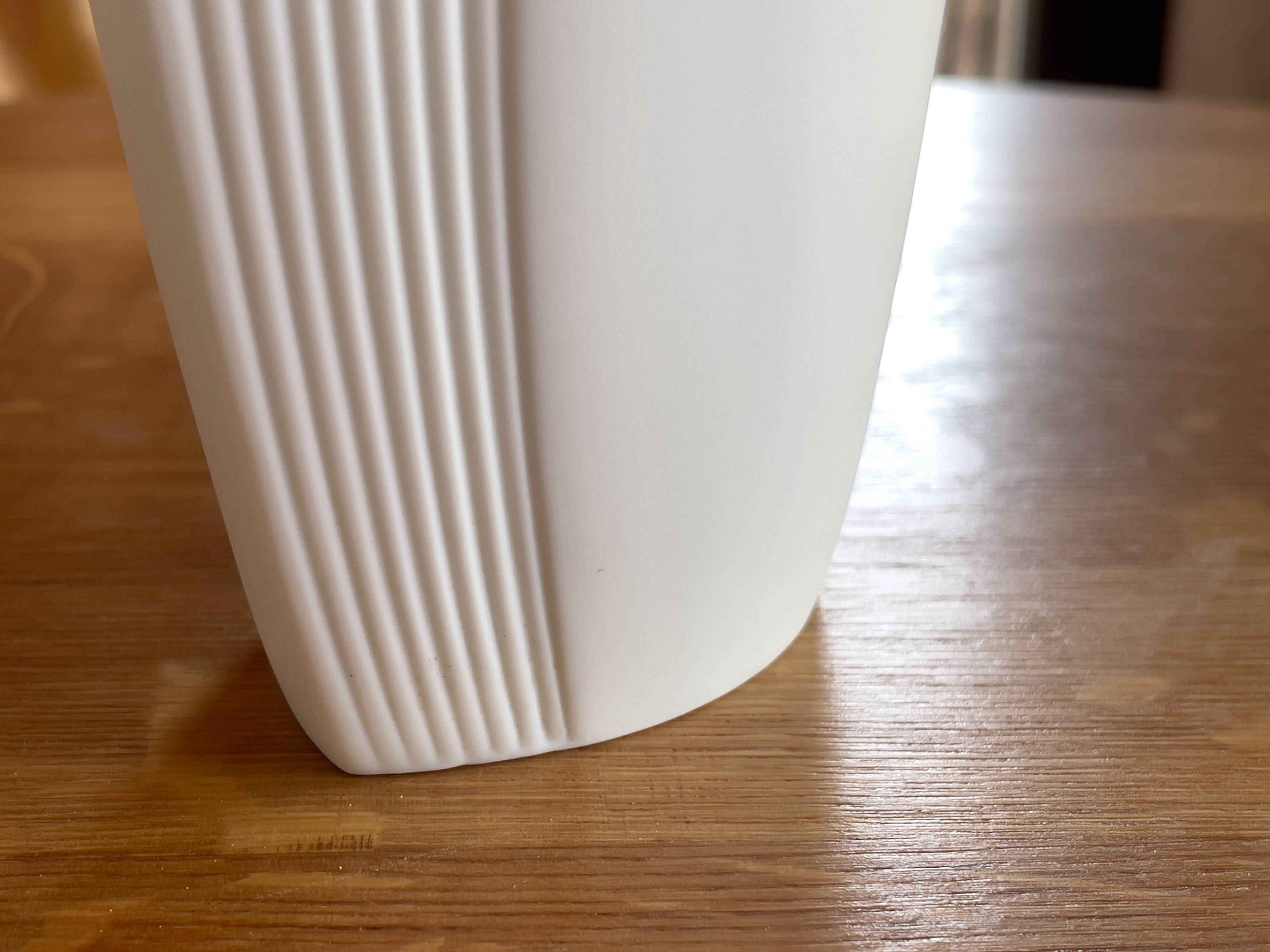 Vintage white porcelain vase AK Kaiser. It is signed Manfred Frey, 1960