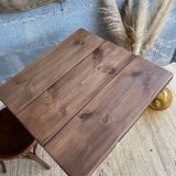 Bistro table with central cast iron leg and rustic top