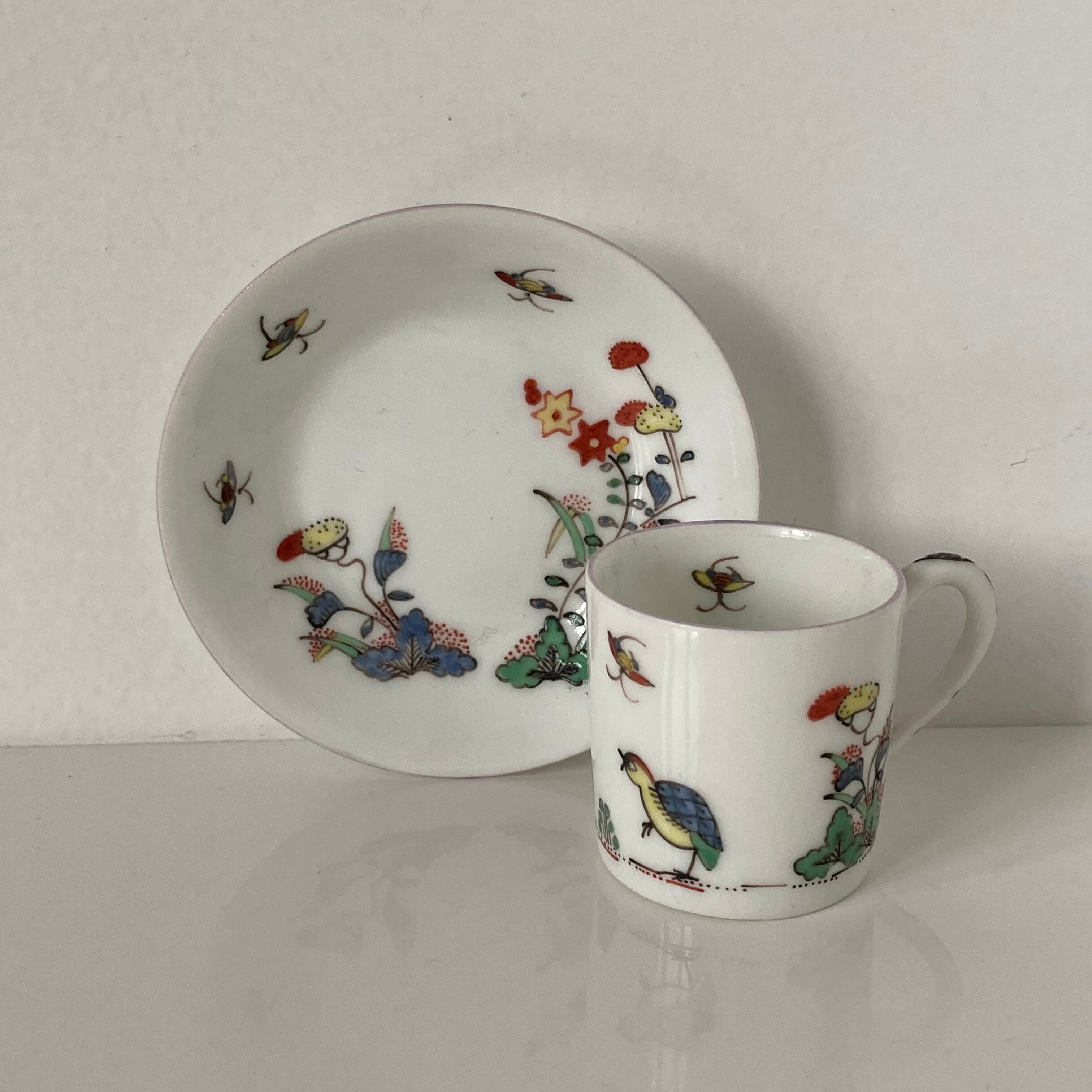 Limoges porcelain cup and sub-cup decorated in Chantilly in the Japanese Kakiemon style