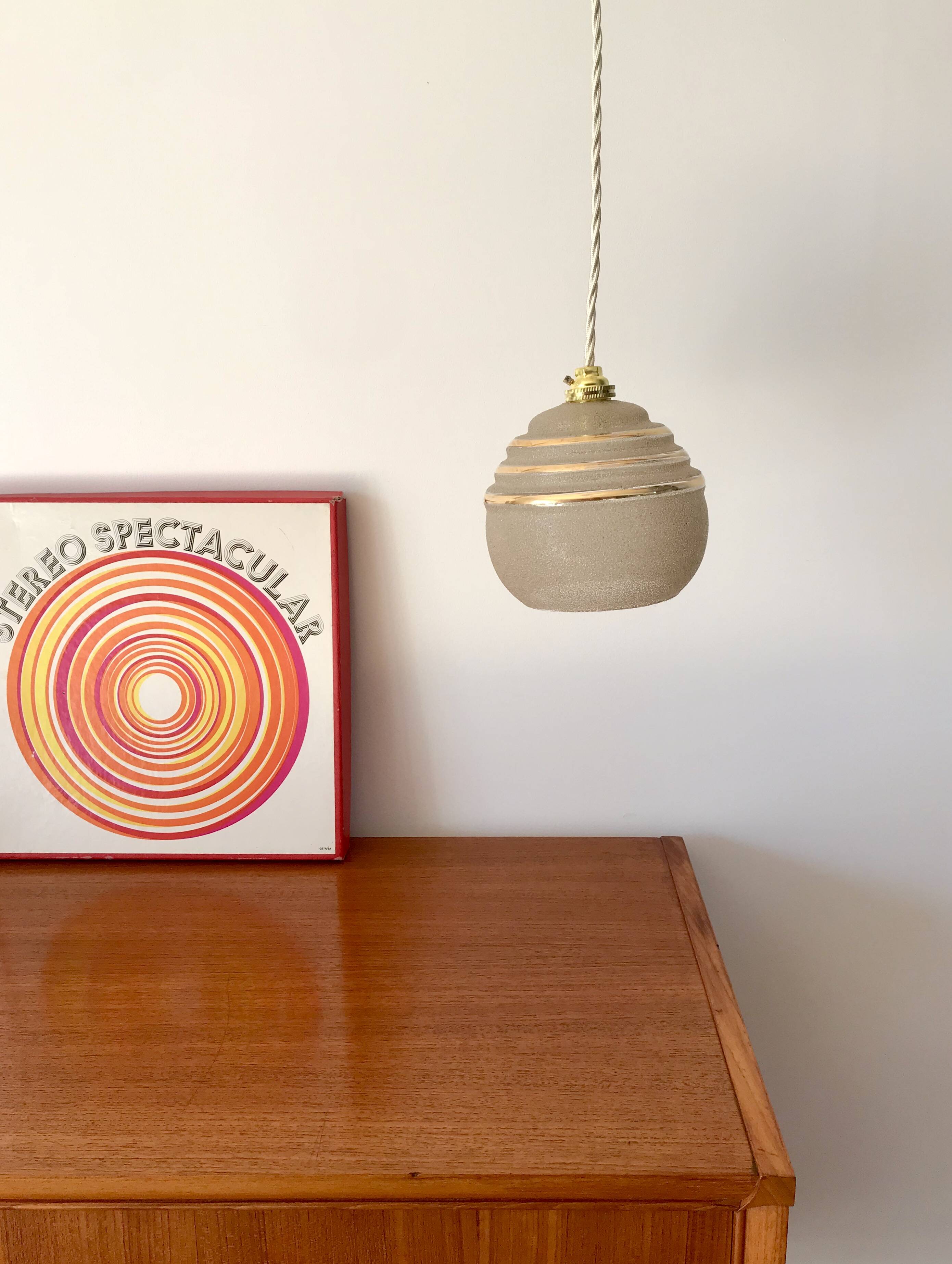ball pendant light in white granite glass and gold edging from the 1950s