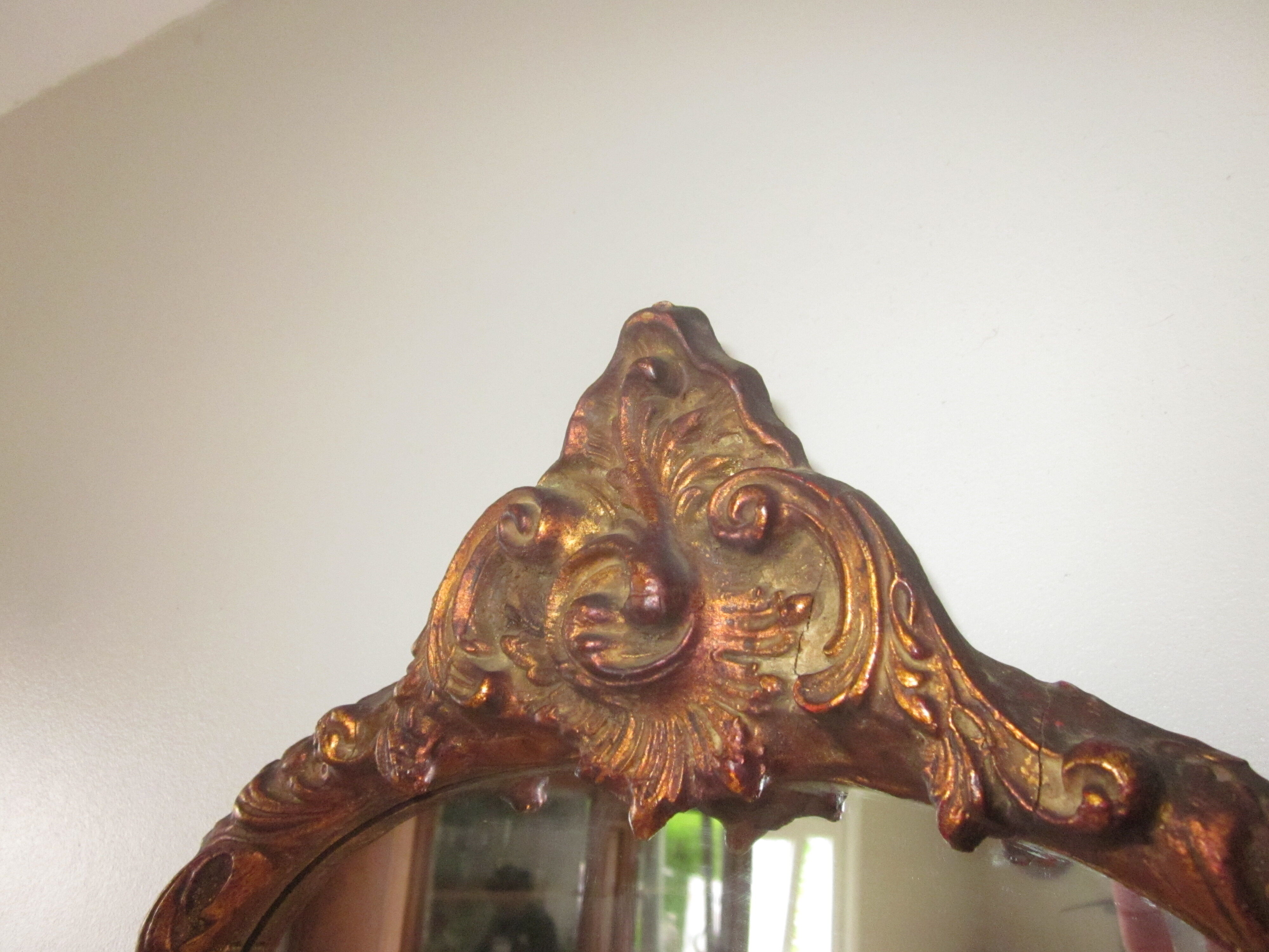 Old mirror in wood and stucco dorè