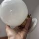 Pair of wall sconces with white opaline globes