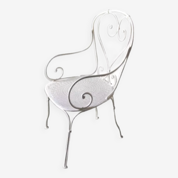 Openwork white wrought iron armchair