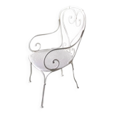 White openwork wrought iron armchair