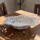 Vintage cup in openwork porcelain lace