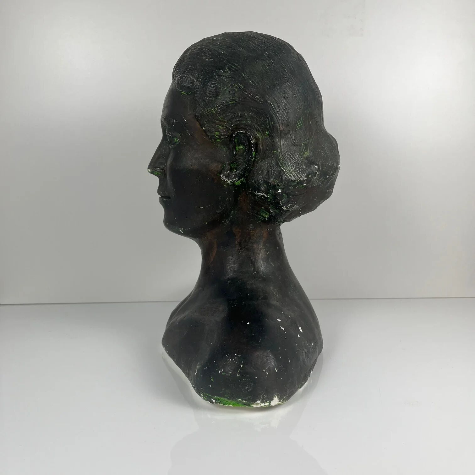 Female bust in neoclassical style in plaster by M. Mongey, 20th century.