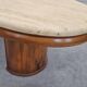 Mid-century coffee table in walnut with a travertine top.