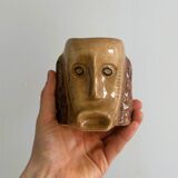 Faces ceramic mug.