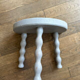 Small tripod stool in gray wood