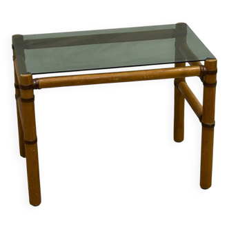 Blonde wood coffee table with smoked glass and leather bindings.