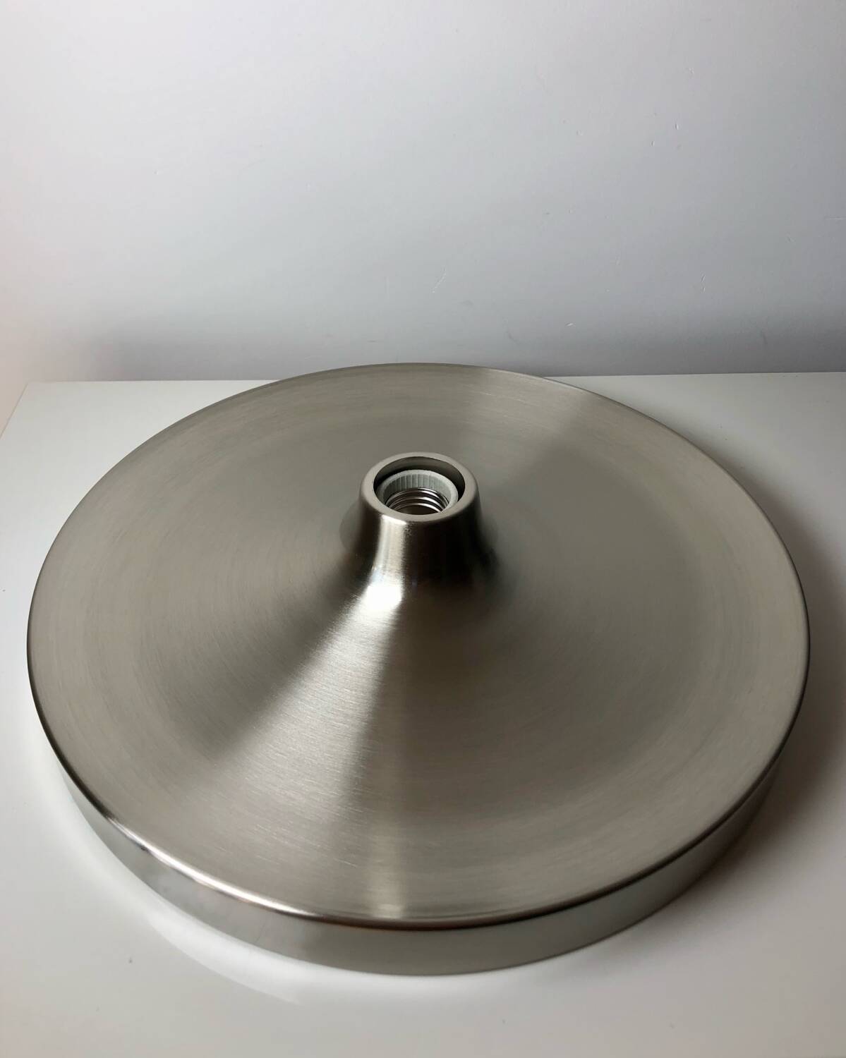 Modernist disc wall sconce