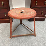 Red tripod industrial metal stool