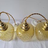 Trio of yellow glass pendant lights