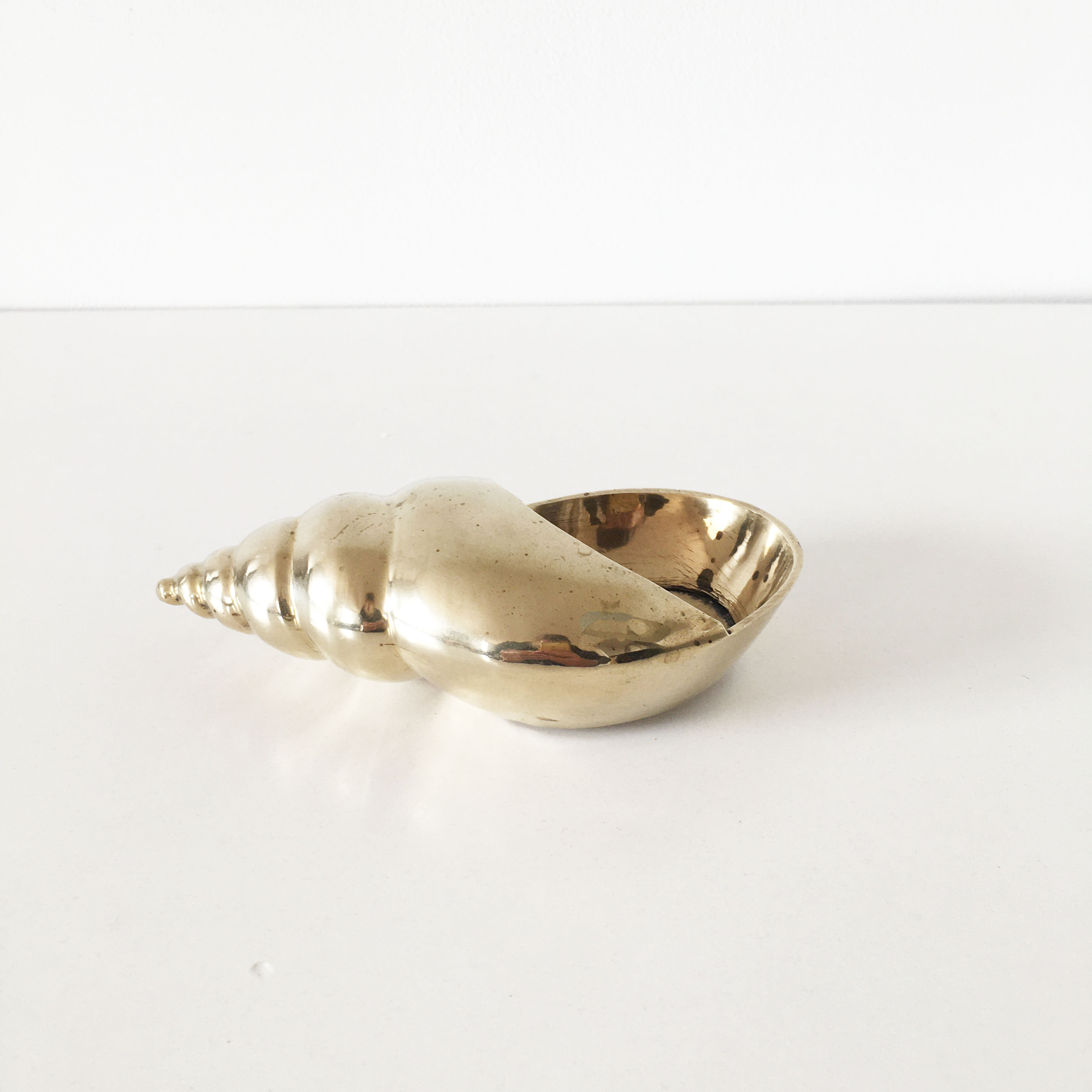 Vintage brass shell ashtray