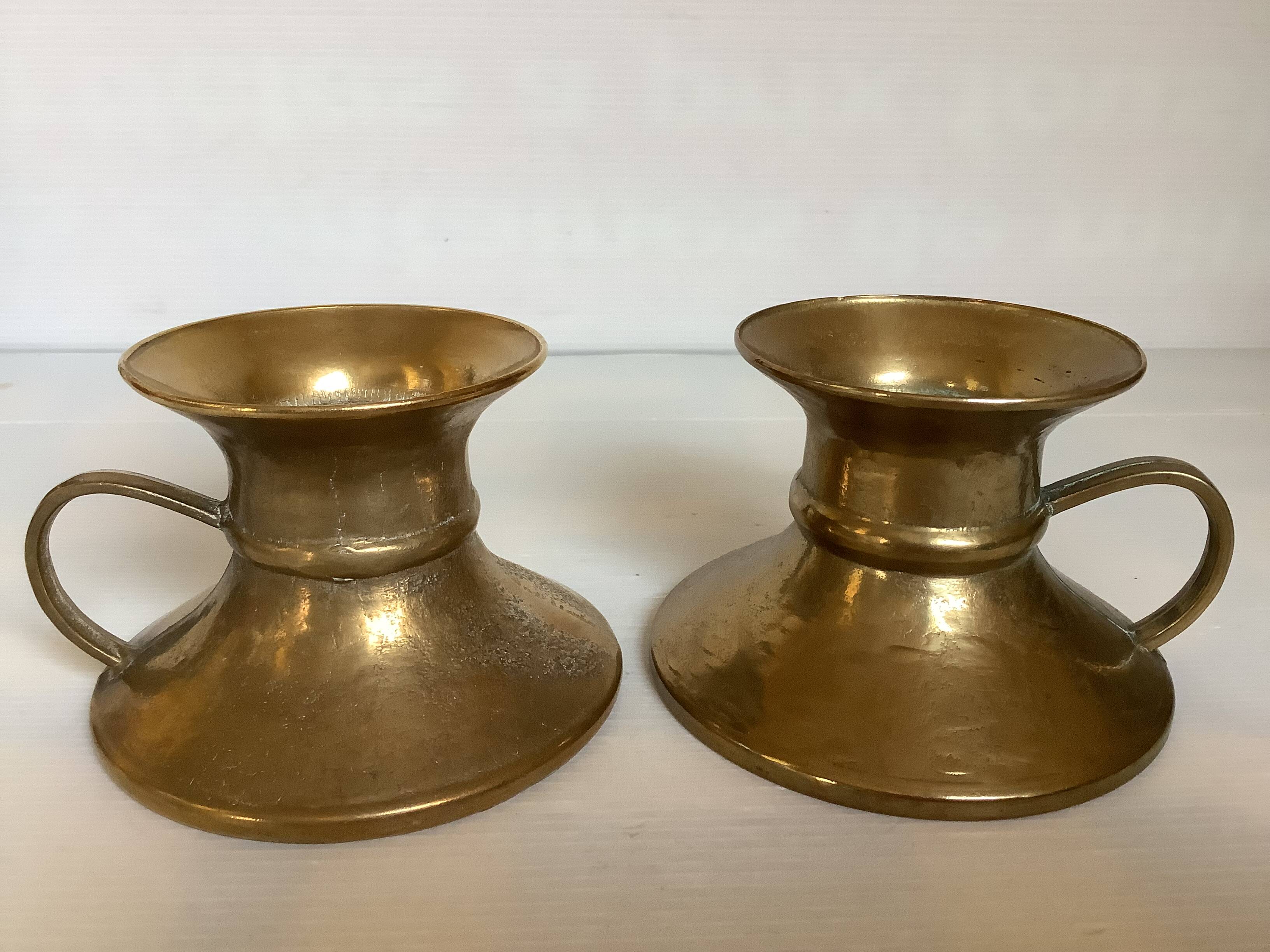 Pair of rat cave candlesticks with tulip base in bronze.