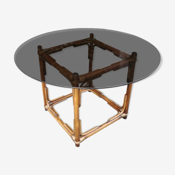 Round table in smoked glass and rattan ø120