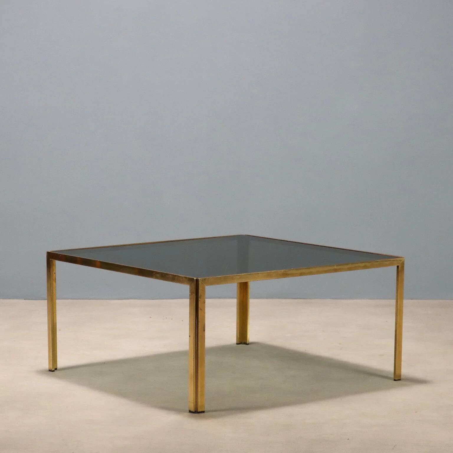 Vintage coffee table in brass and smoked glass, 1970s design.