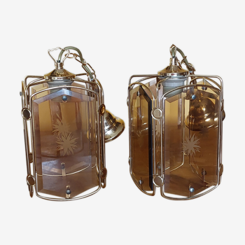 Pair of chandeliers in gilded brass and smoked glasses, year 1980/90