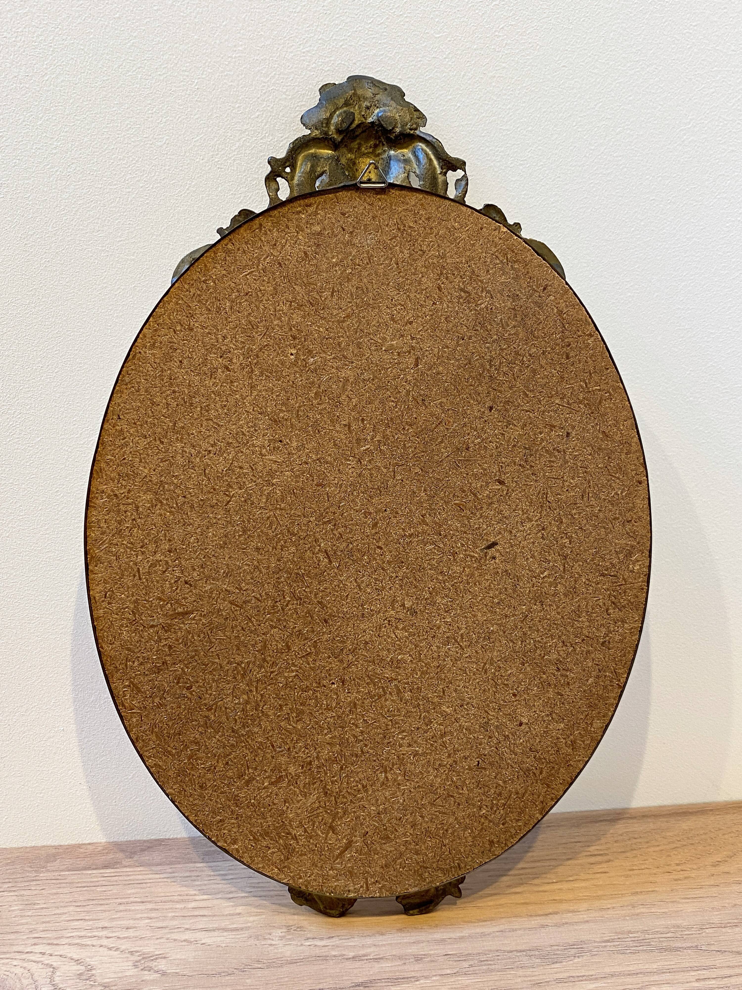 Oval bronze mirror