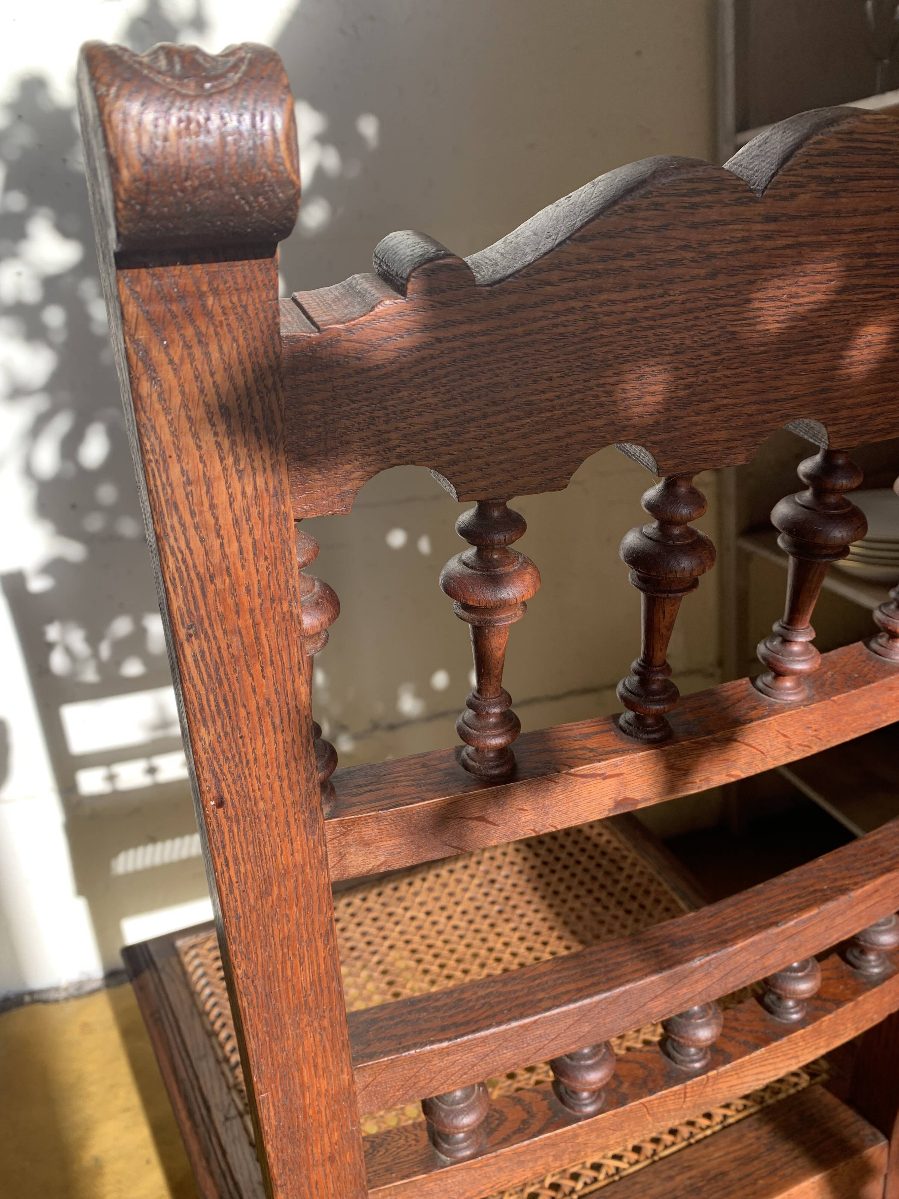 6 carved wooden chairs with cane seats