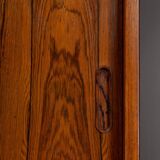 Rosewood library designed by Danish designers with doors by Hundevad & Co, 1960s.