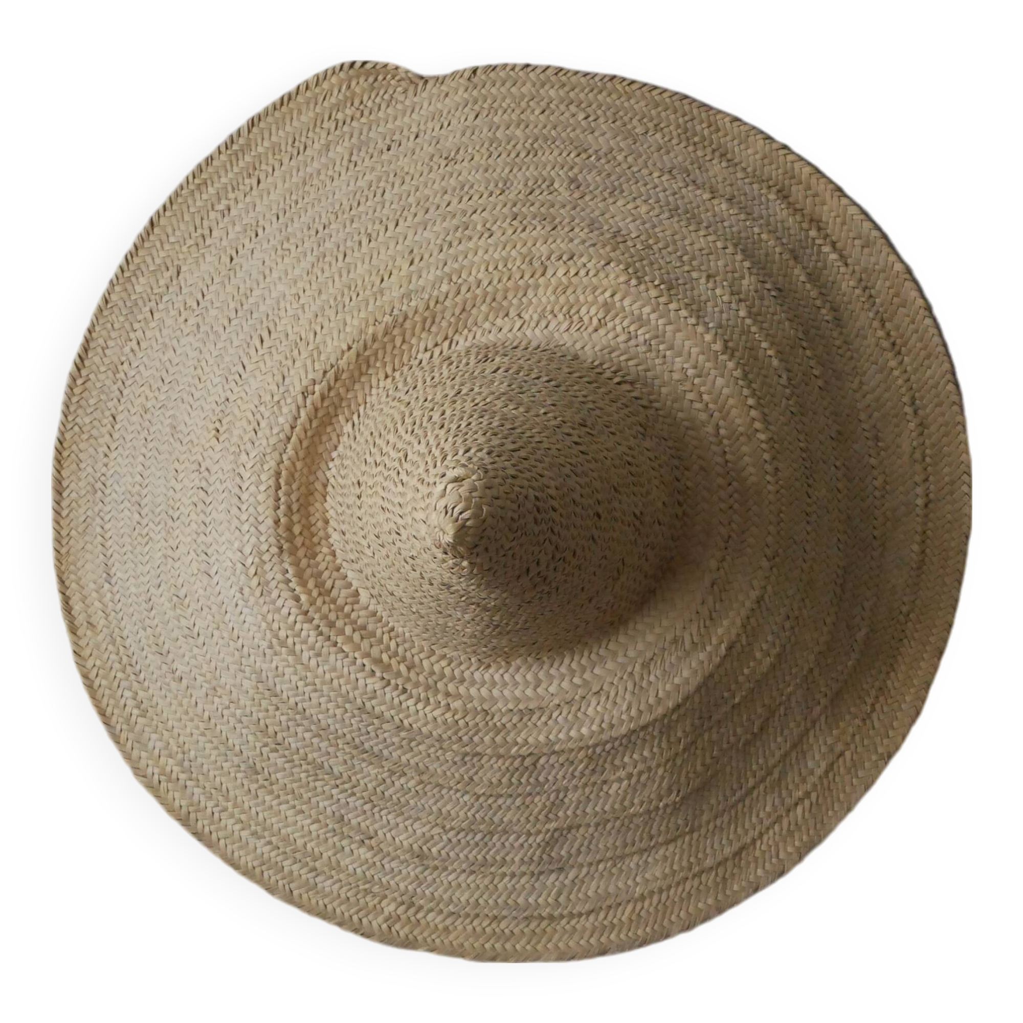 Hand-woven wicker straw hat, artisanal production, decorative object, bohemian ethnic countryside