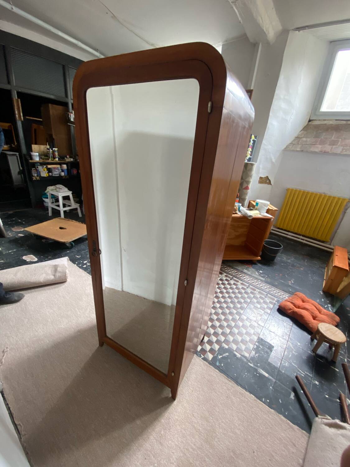 Pair of rounded mirrored wardrobes