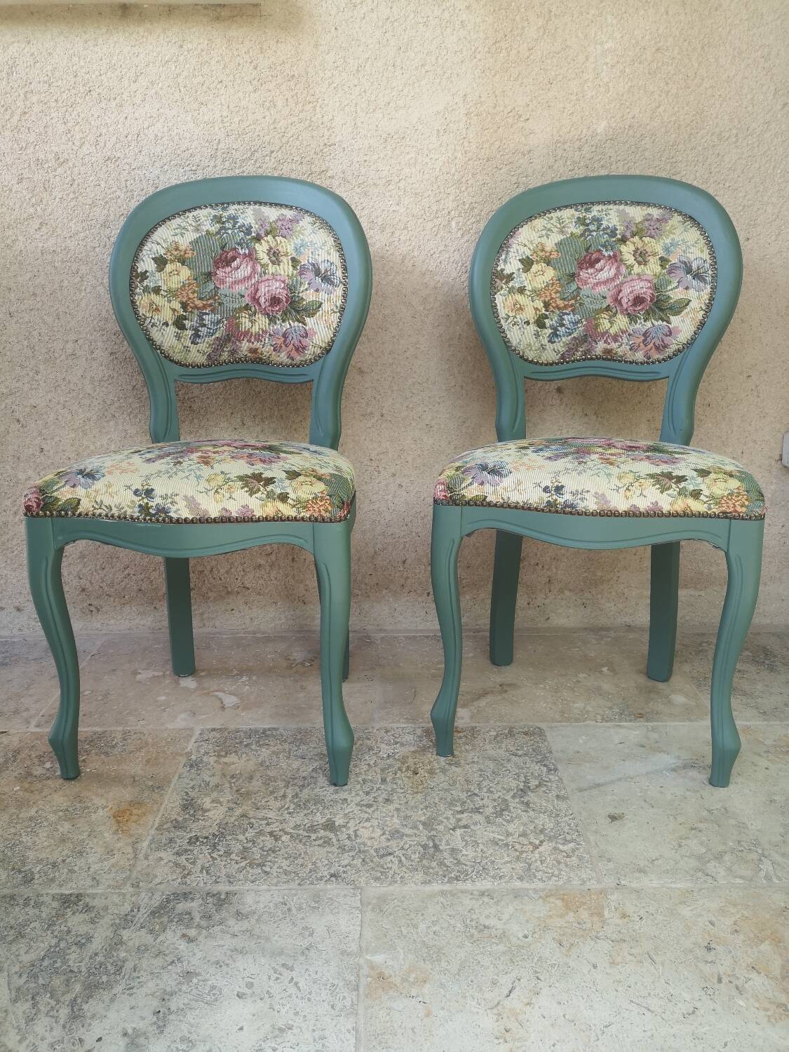 Antique chairs with studded upholstery.