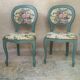 Antique chairs with studded upholstery.