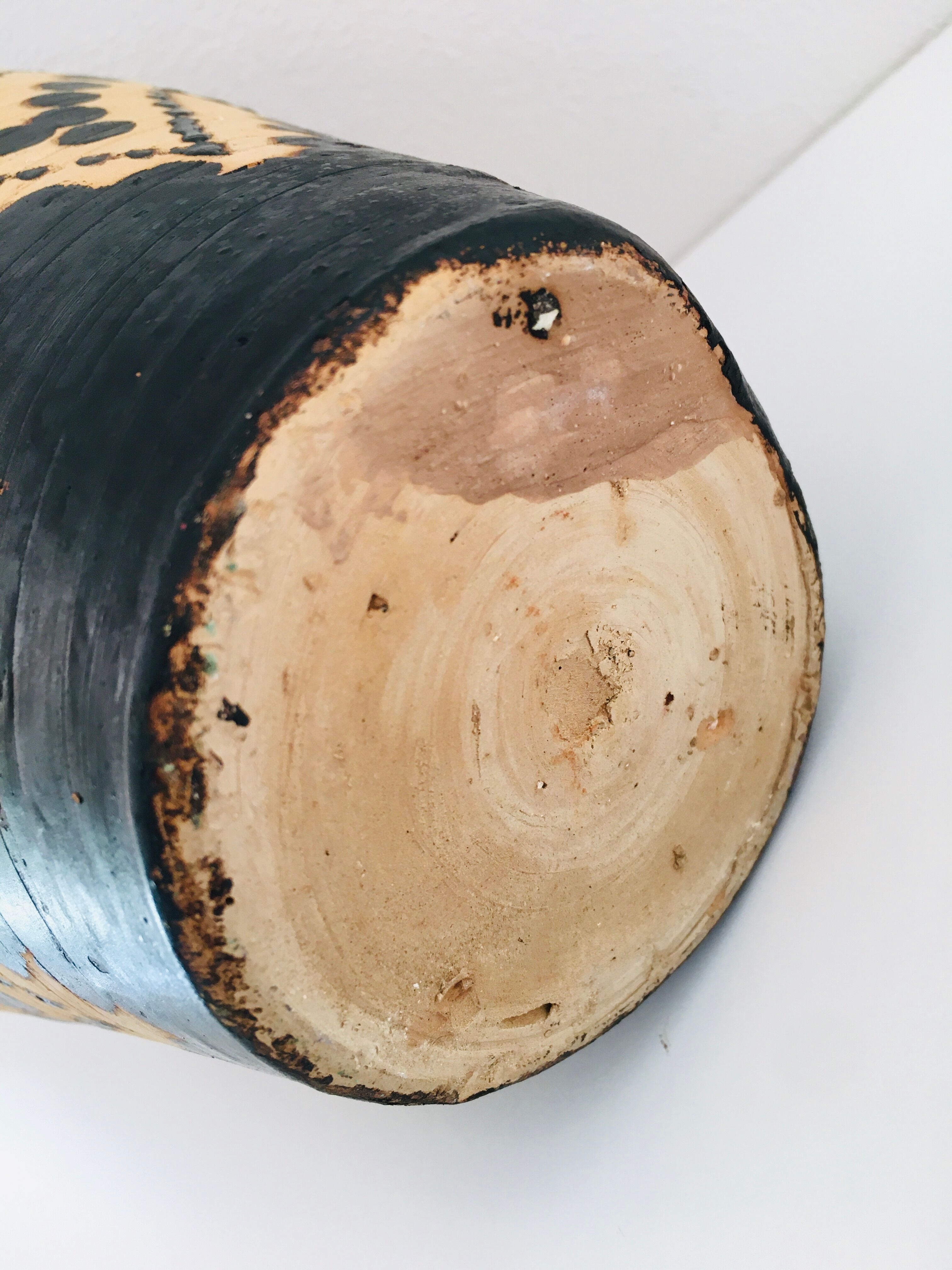 Raw and black terracotta jug