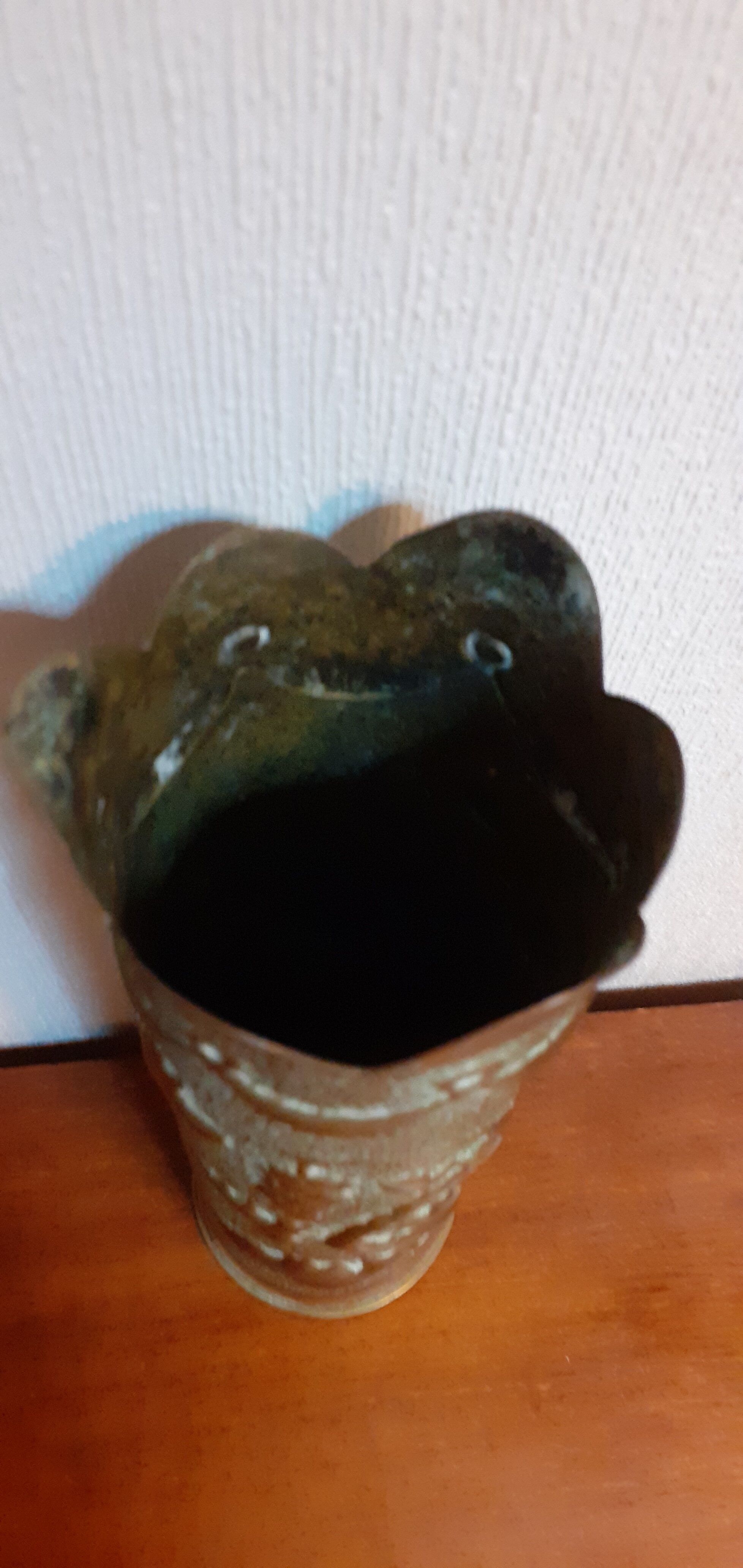 Shell casing vase carved into the trenches