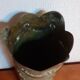 Shell casing vase carved into the trenches
