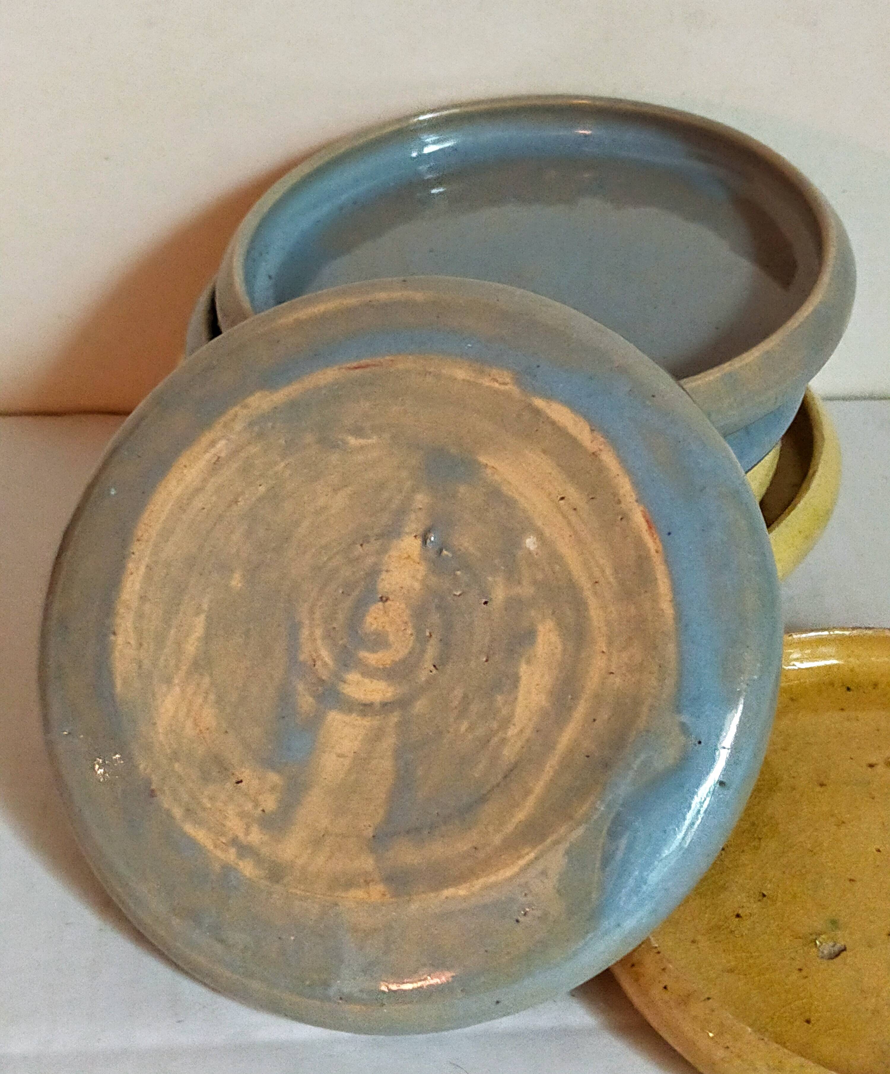 Seven vintage potter's sweet treat plates