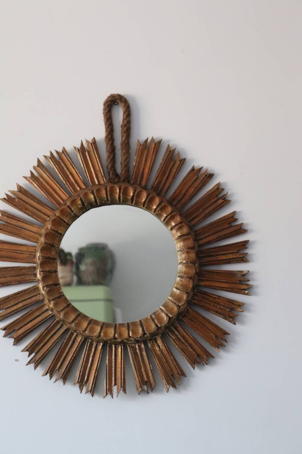 Old large sun mirror in gilded wood