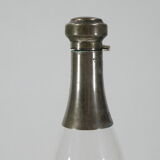 Bottle in glass and metal