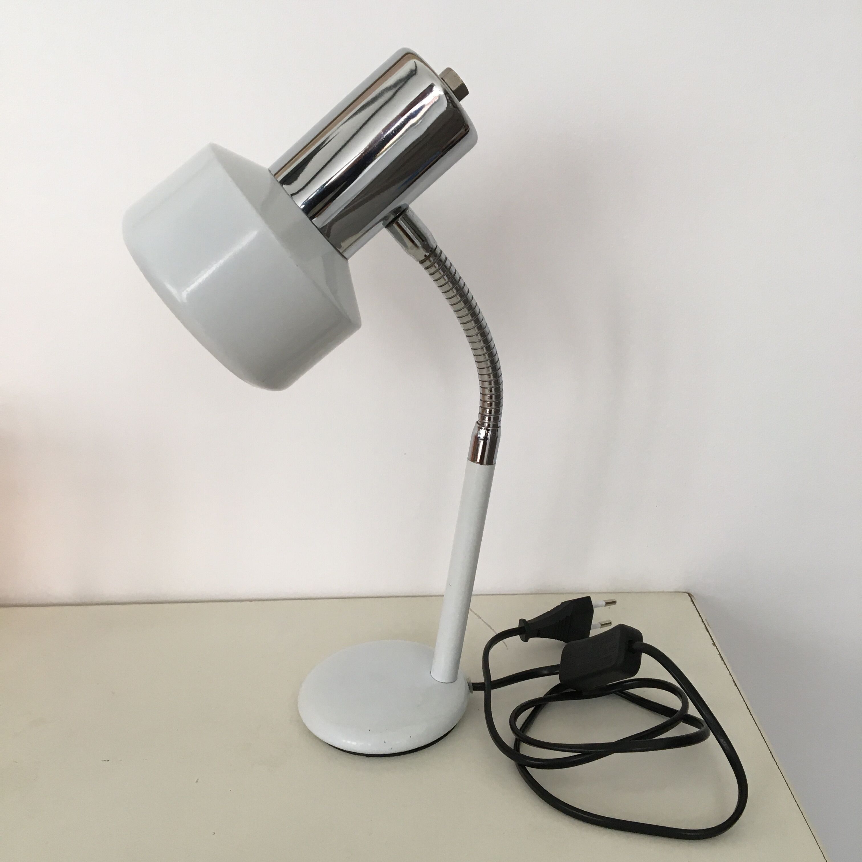 flexible white and stainless steel desk lamp