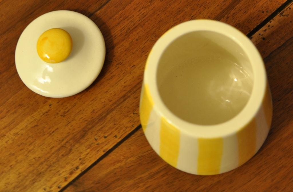 Yellow and white striped cover pot