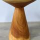 Minimalist side table in solid suar wood with conical legs.