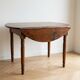 Antique dining table with drop leaves, wood.