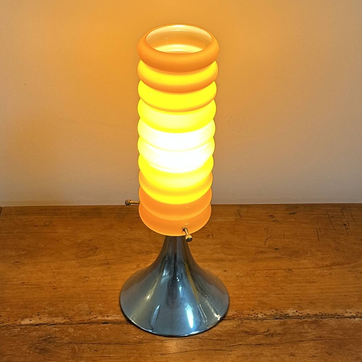 Vintage orange lamp with chrome tulip base and glass shade