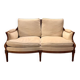 Two-seater canapé by Roche Bobois in Louis XVI style — carved wood, caned sides.