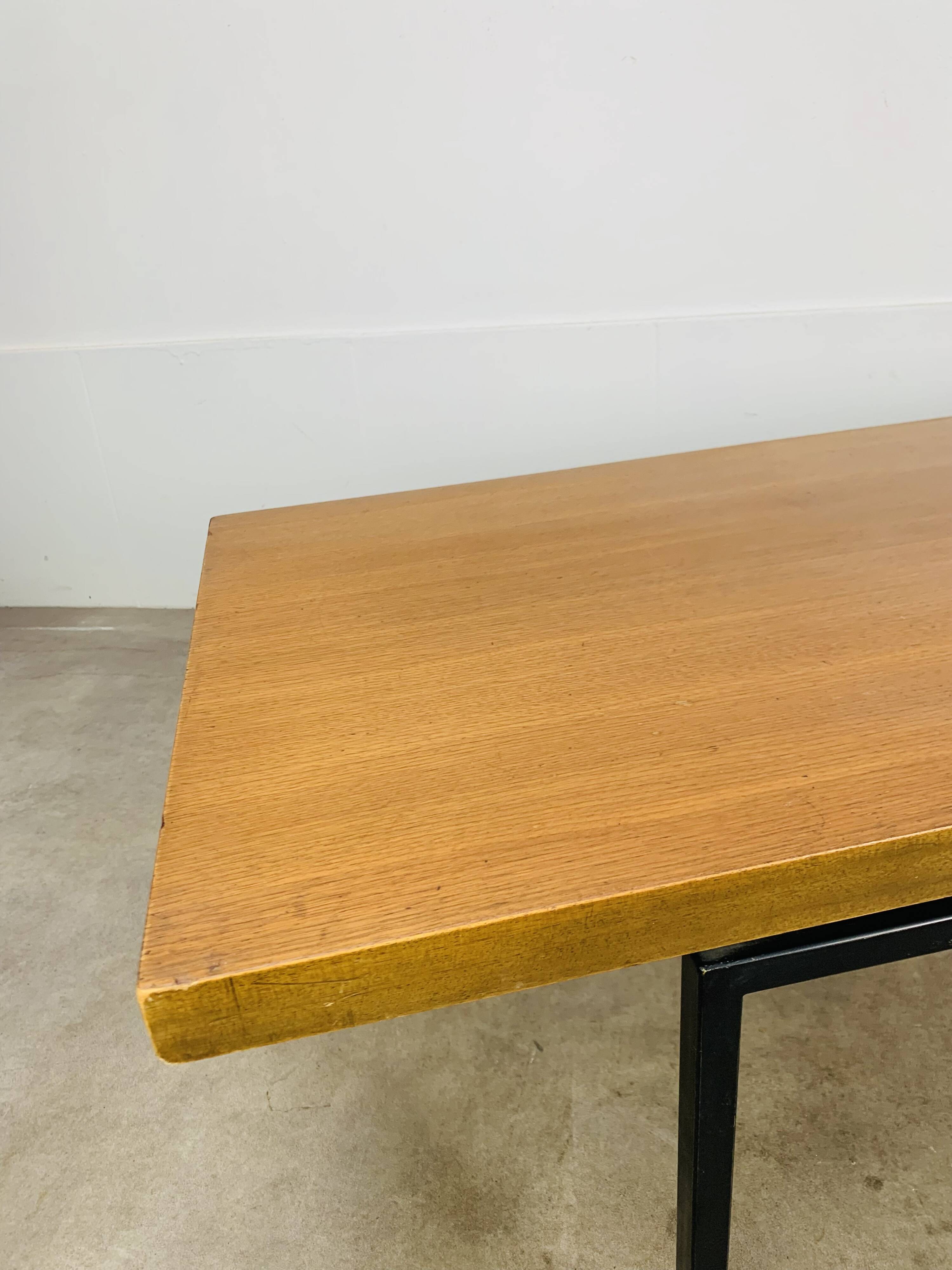 1950s modernist coffee table, wood and black metal.