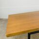 1950s modernist coffee table, wood and black metal.