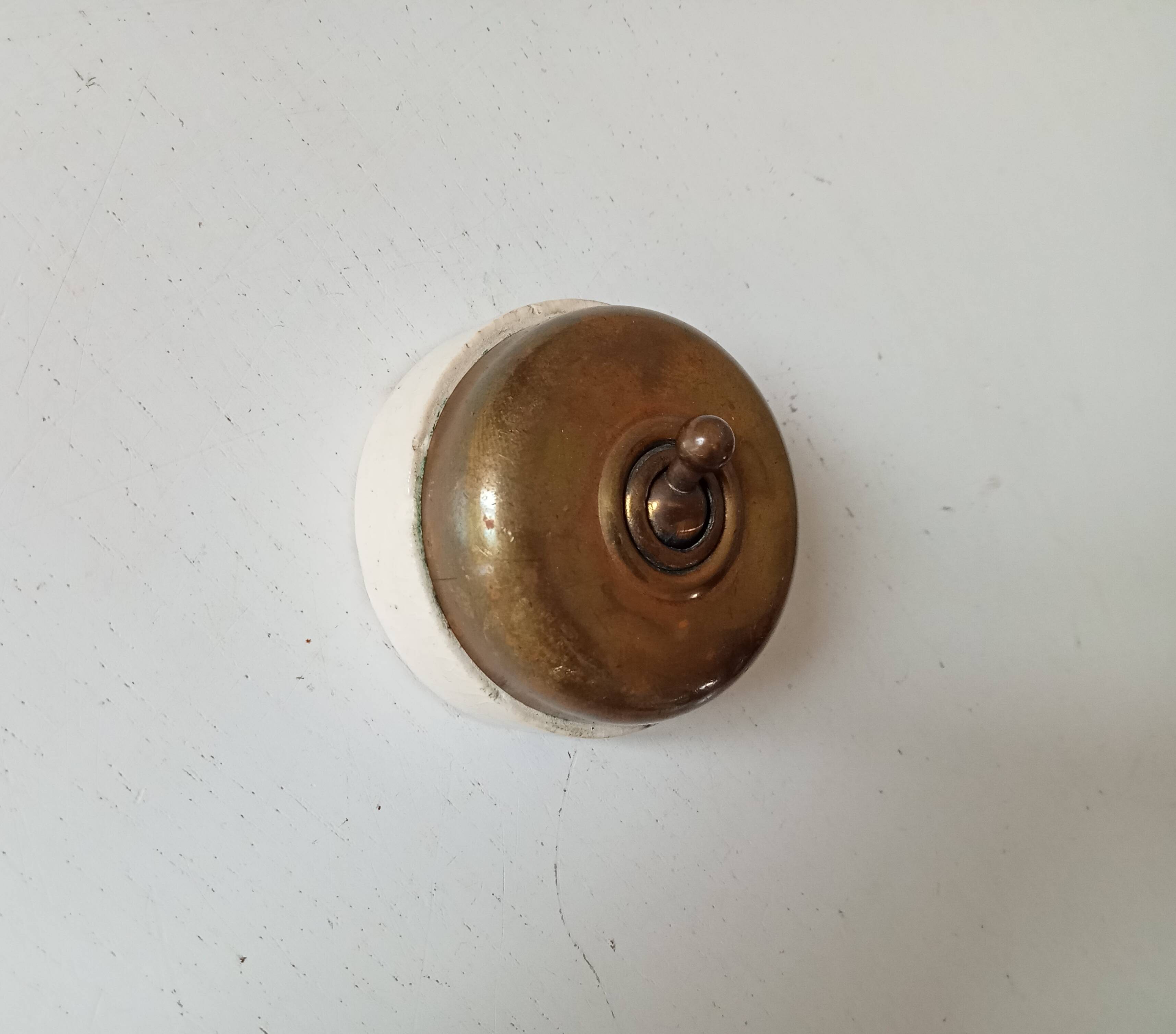 Antique brass and porcelain switch from the 40s/50s